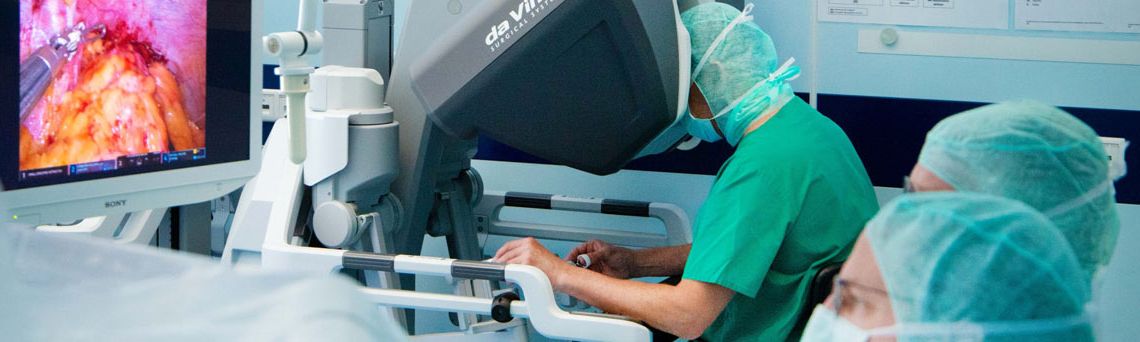 View of a robot-assisted operation with three doctors